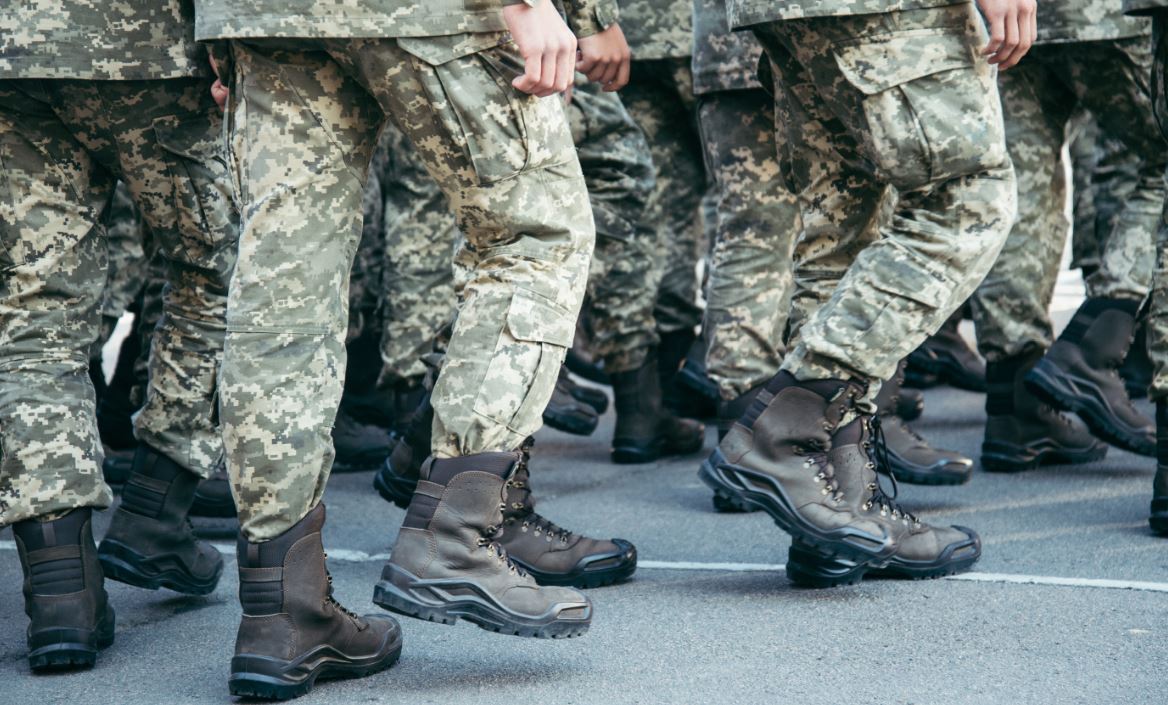 Army men marching to show boots on the ground