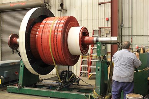 A large electric motor undergoing balance testing.