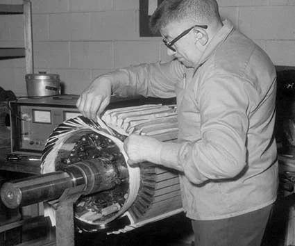 Skilled mechanic working on an electric motor, showcasing the company’s history of expertise.