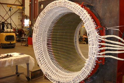 Large electric motor's stator after a rewind.