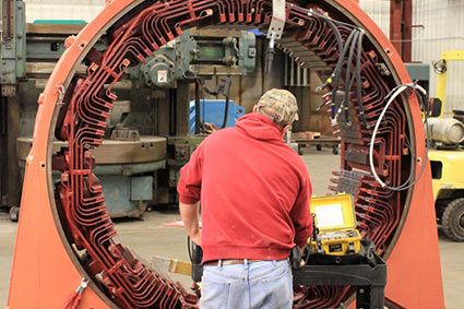 HECO technician working on a large DC motor repair.