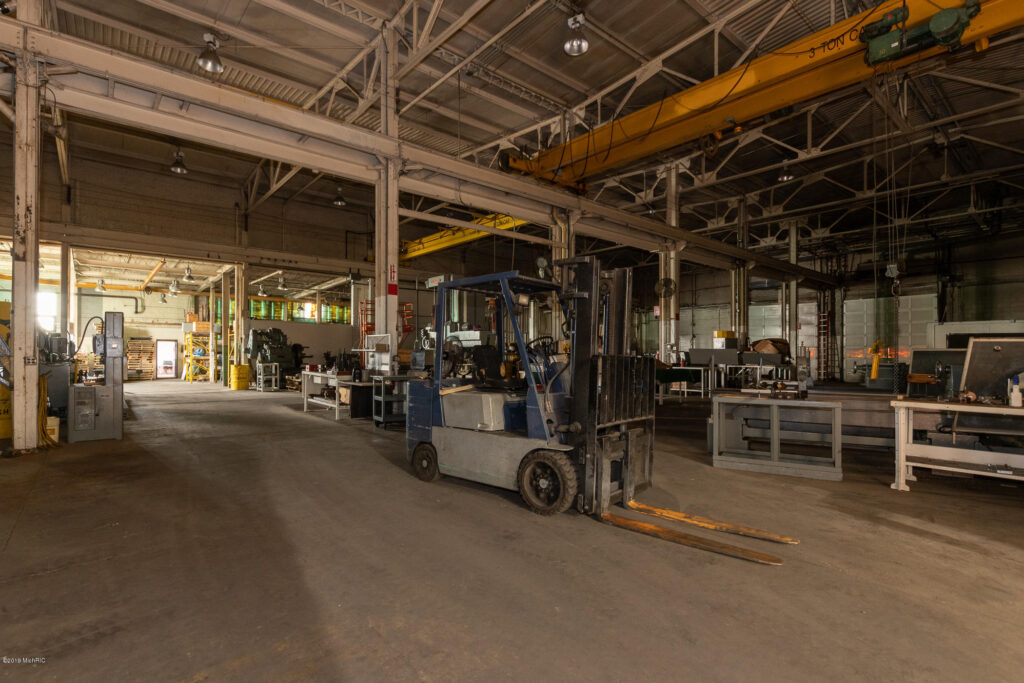 Inside newly acquired HECO building with fork lift
