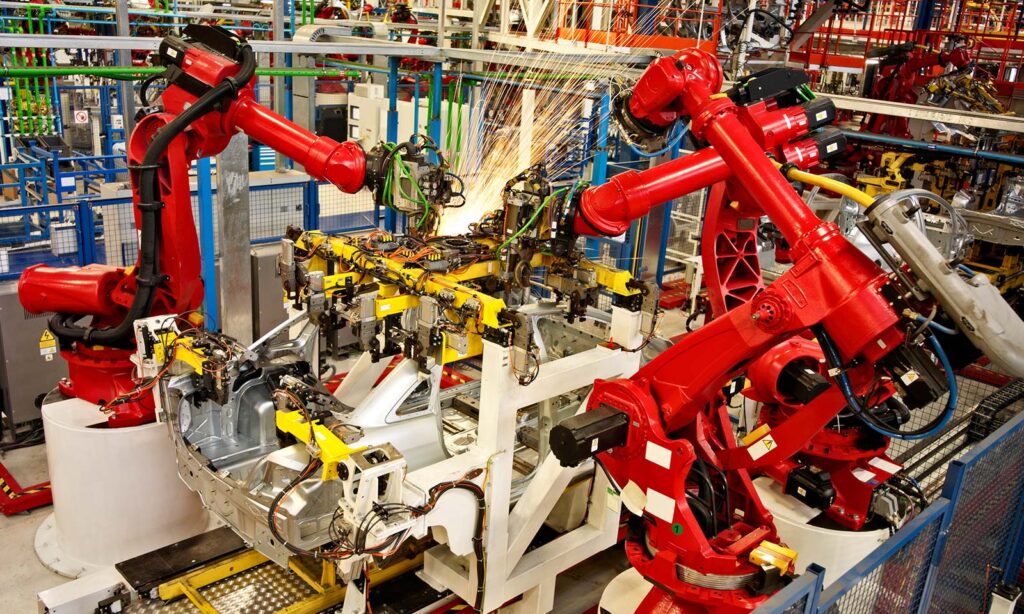 Automotive assembly line with automated robotic arms.