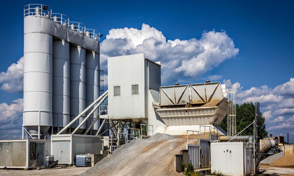 A pile of aggregate outside a cement plant.