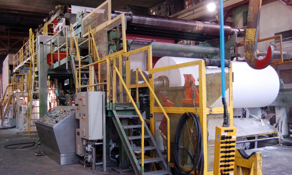 Paper milling machine in a factory producing high-quality paper for drywall.