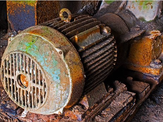 Electric motor that is damaged due to grounding which has left it looking charred